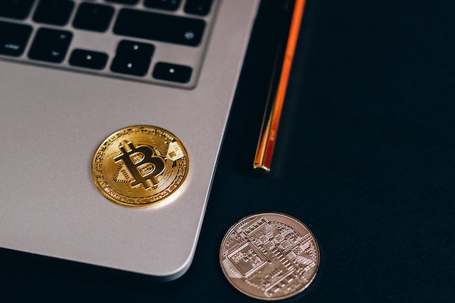 crypto coins on a laptop