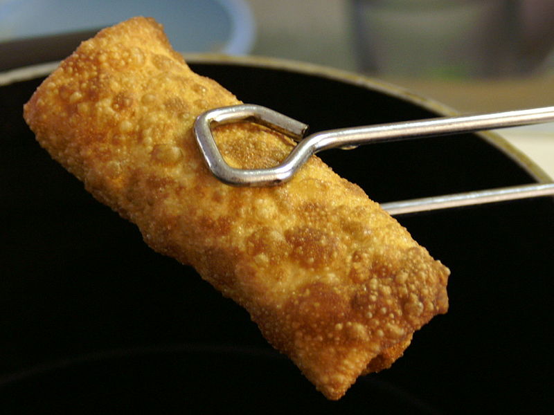 Freshly fried egg roll with rough, bubbly outer skin