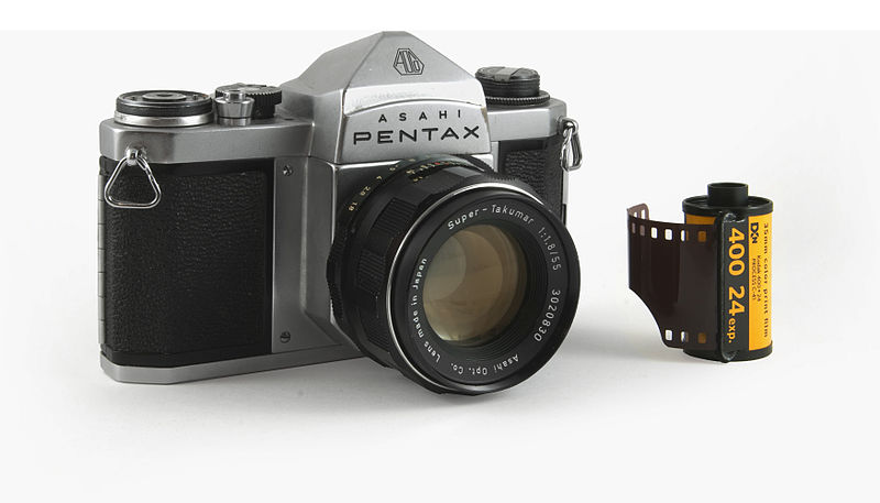 Kodak 35mm film cartridge alongside Asahi Pentax film camera. The shift from film to digital greatly affected Kodak's business