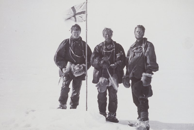Mackay, David and Mawson raise the flag at the South Magnetic Pole