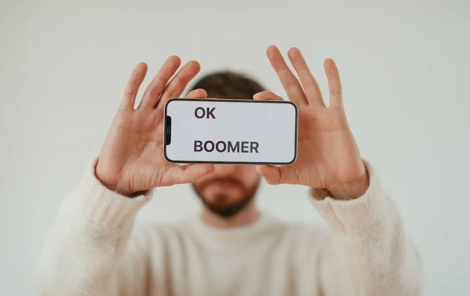 Man Holding Smartphone with Phrase on Screen