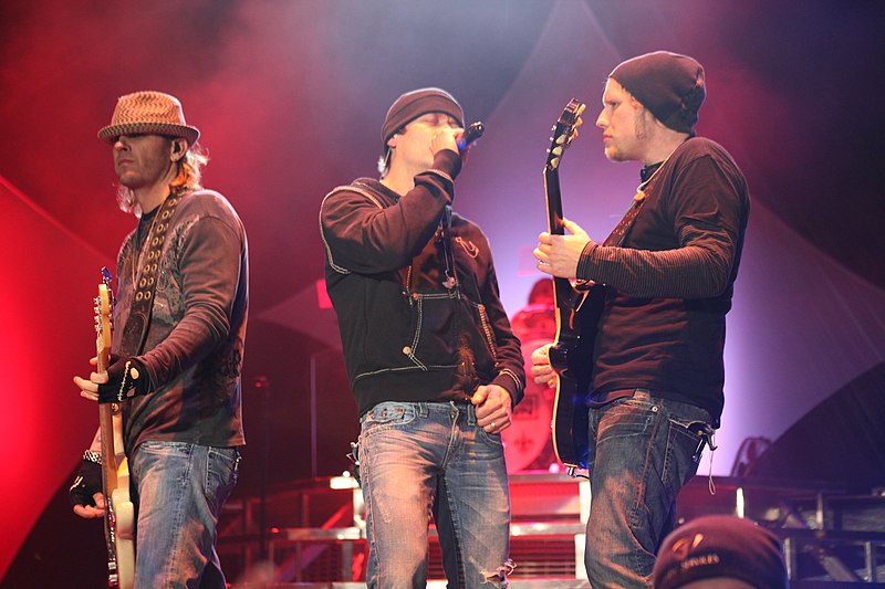 Todd Harrell, Brad Arnold and Matt Roberts performing in 2011