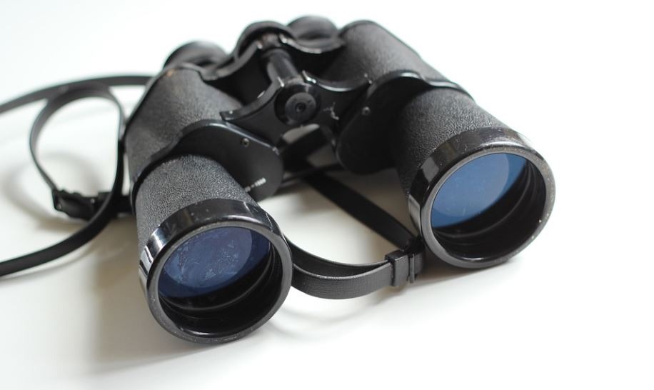 binoculars on a white table
