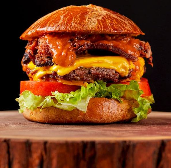 close-up of a hamburger on black background