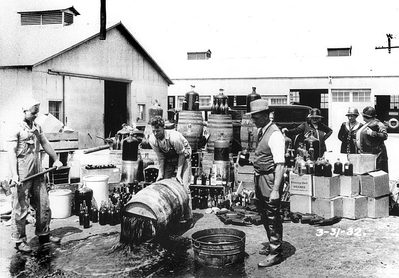 Orange County Sheriff's deputies dumping illegal booze during the Prohibition