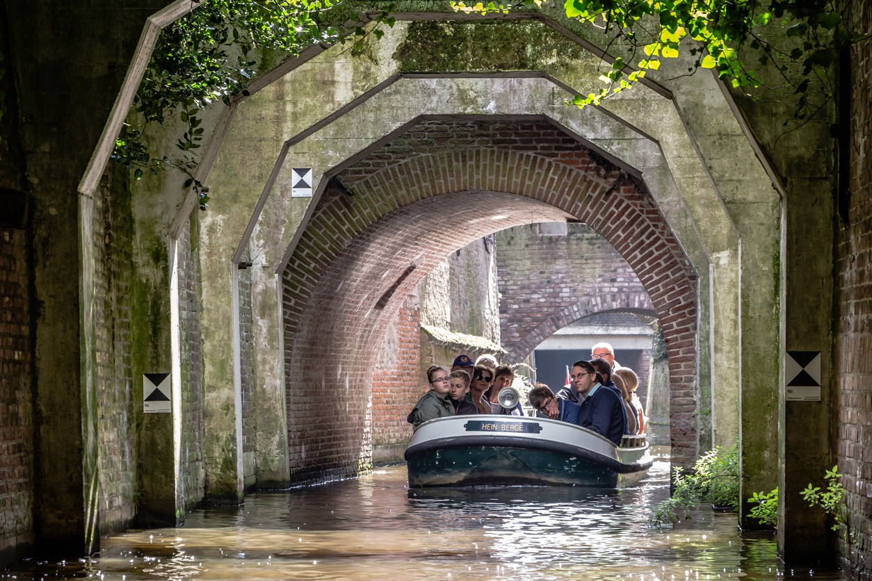 Tourist guide in a boat on the canals of 's-Hertogebosch