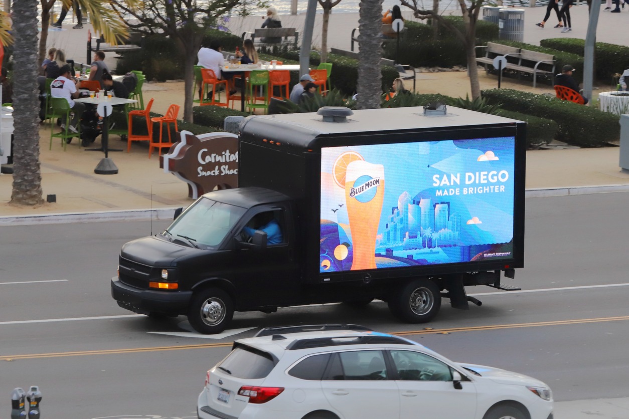 a Blue Moon Beer ad on a truck in a road in San Diego, California