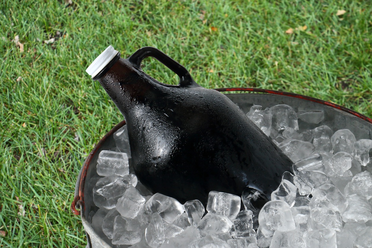 a beer growler in an ice bucket