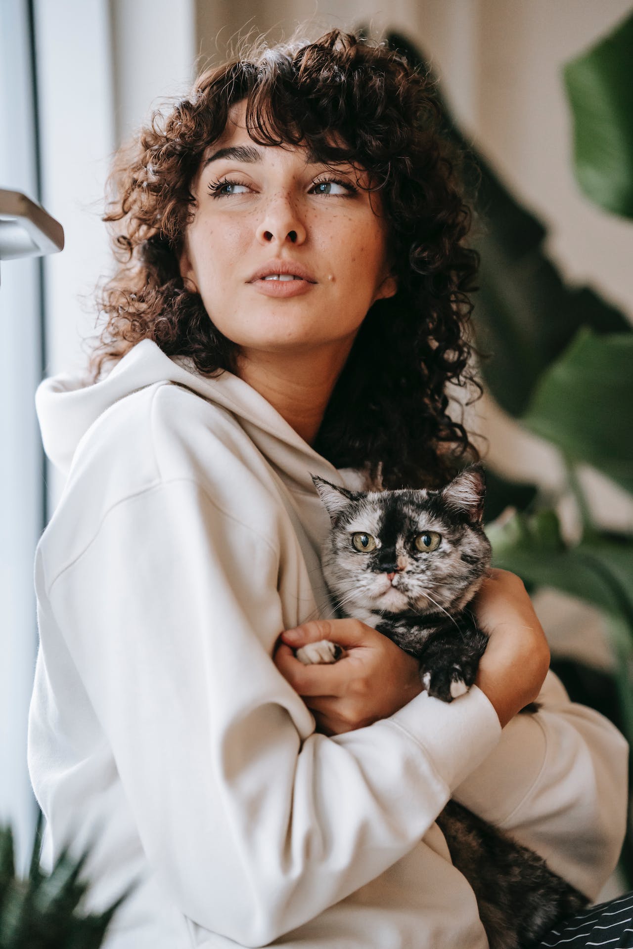 woman holding her cat
