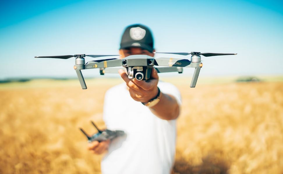 Drone, Camera, Nature, Field, Yard, Outdoor, Bokeh, Grass, Product, Sun, Electronics, Meadow, Remote Control, Blue, Sky, Person, Blur