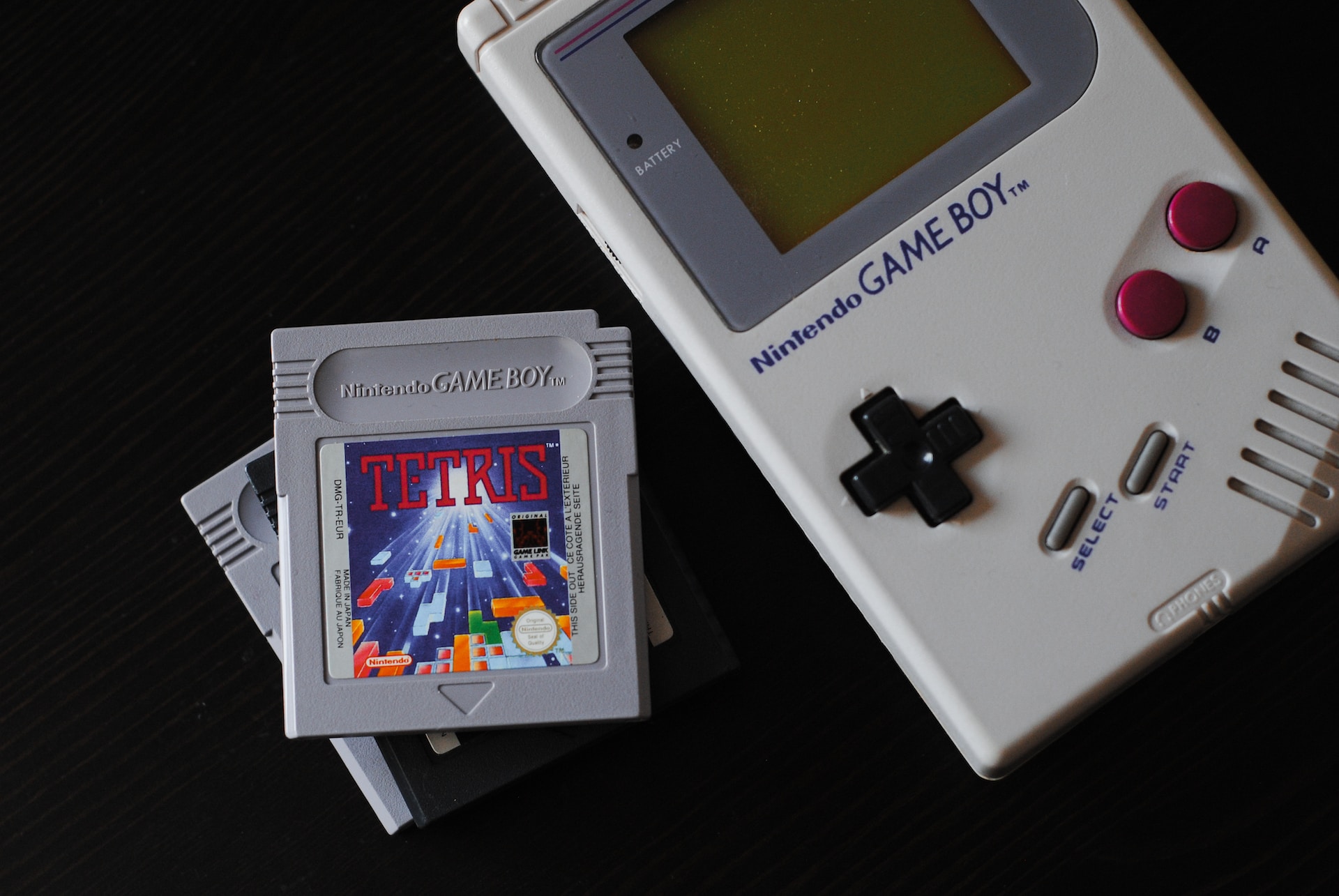 Gray-colored GameBoy and Tetris