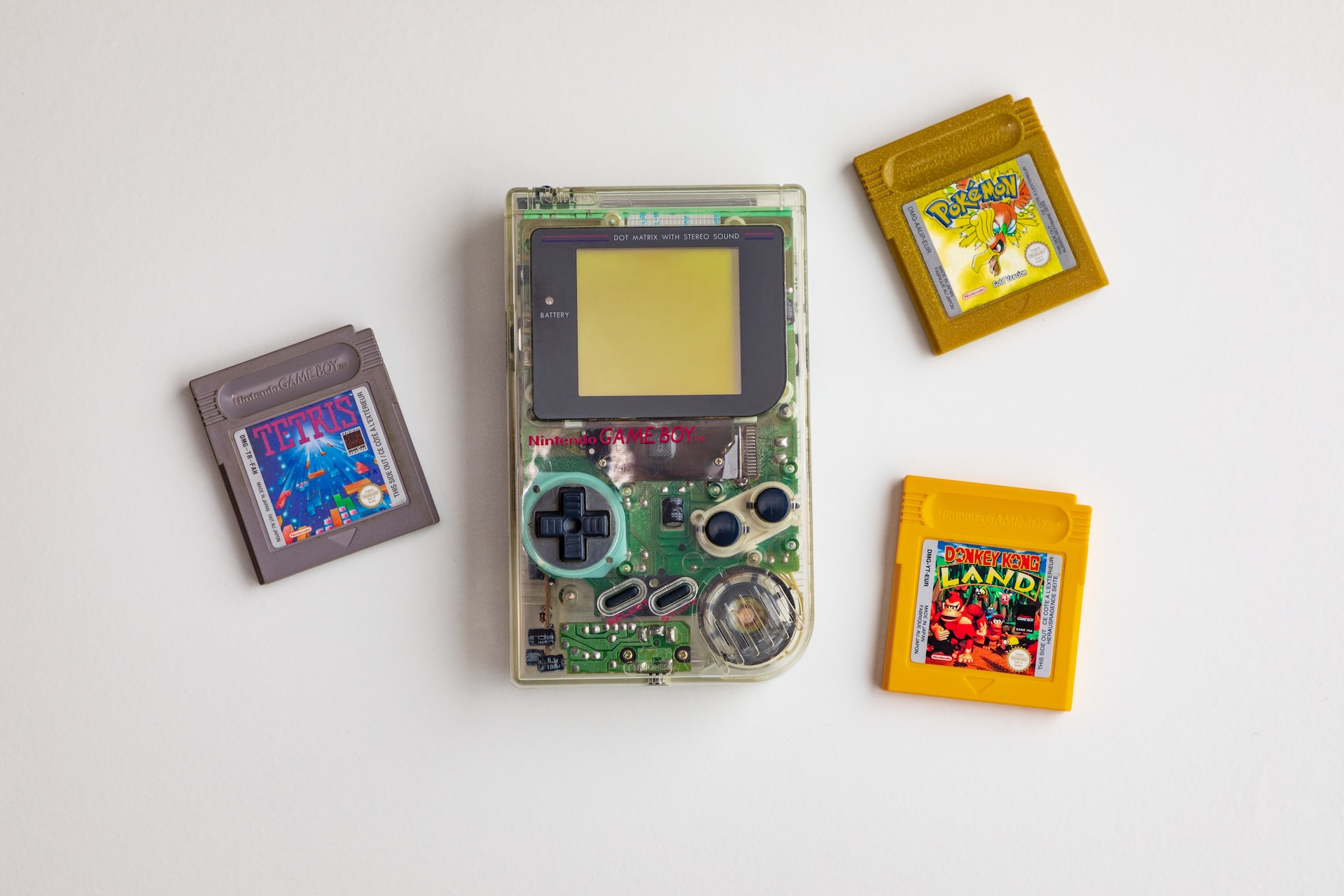 Yellow Play It Out Loud! Game Boy with 3 games next to it
