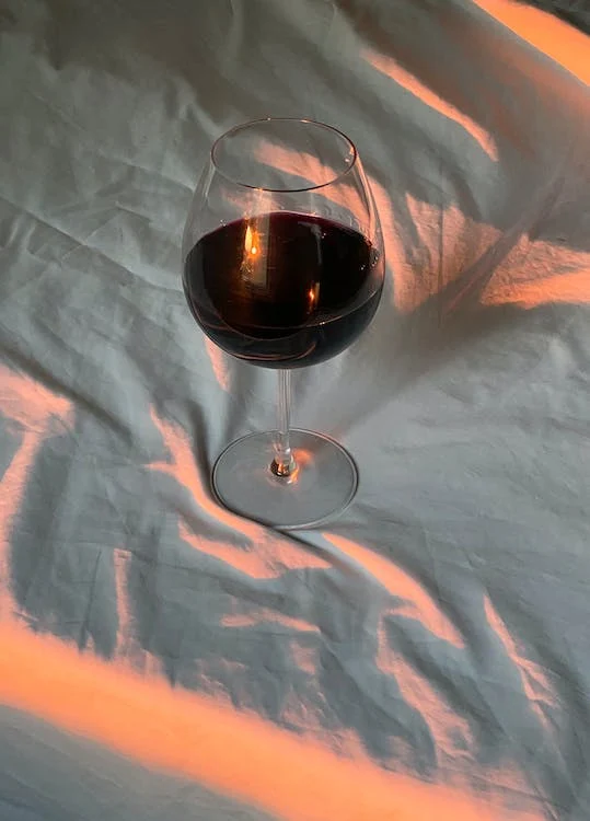 Glass of wine on white cloth