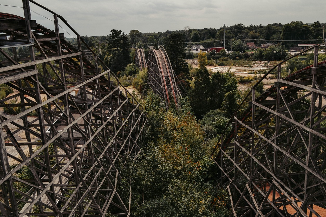 a roller coaster in an abandoned theme park