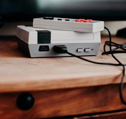 a Nintendo Entertainment System on a wooden table