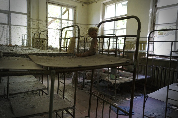 a doll on the bed inside the abandoned city of Pripyat