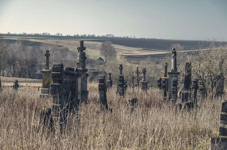 an old cemetery on a hill
