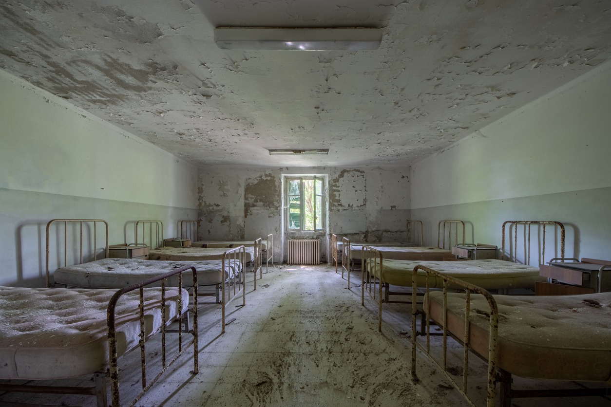 inside a ward of an abandoned hospital