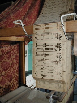 punched cards in a Jacquard loom