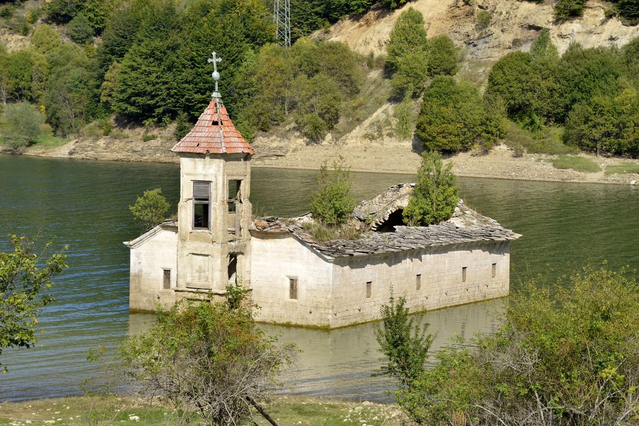 the remains of St. Nicholas Church submerged in water