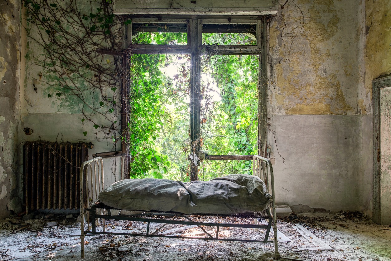 A ruined hospital lies crumbling on the abandoned and supposedly haunted Poveglia Island in Italy