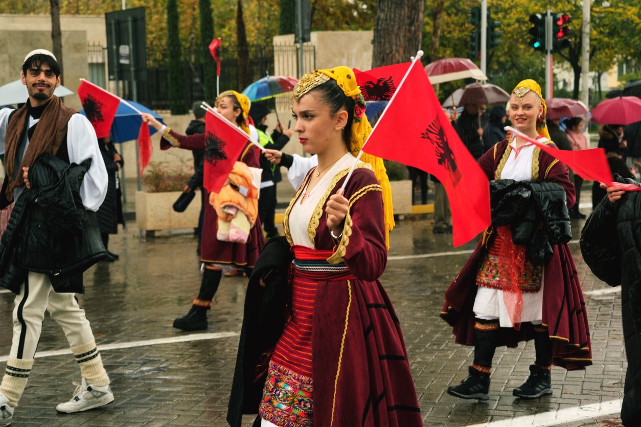 Albanian women on a parade wearing traditional dresses