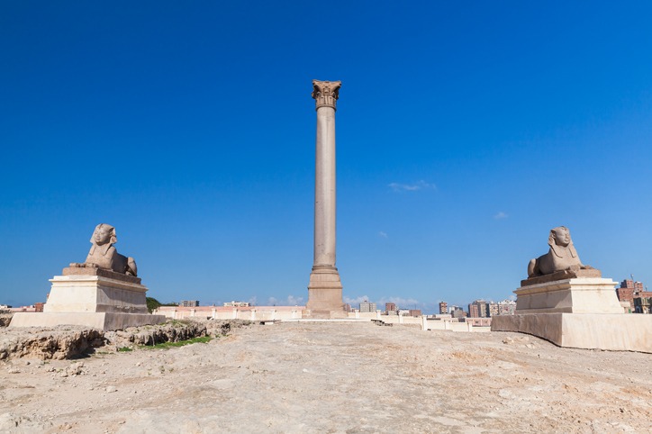 Pompey’s Pillar and ancient sphinxes in Alexandria, Egypt