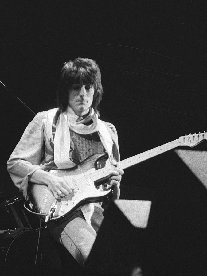 Ronnie Wood playing the guitar at a Rolling Stones concert