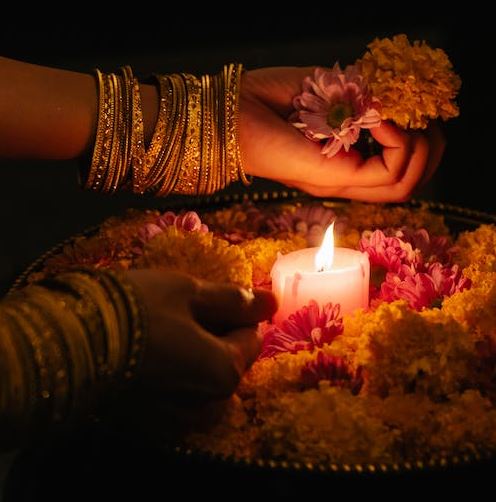 Woman Lighting Candle for Ceremony