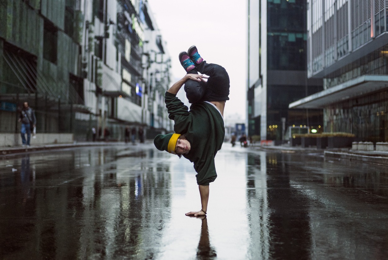 a street dancer / breakdancer doing a handstand