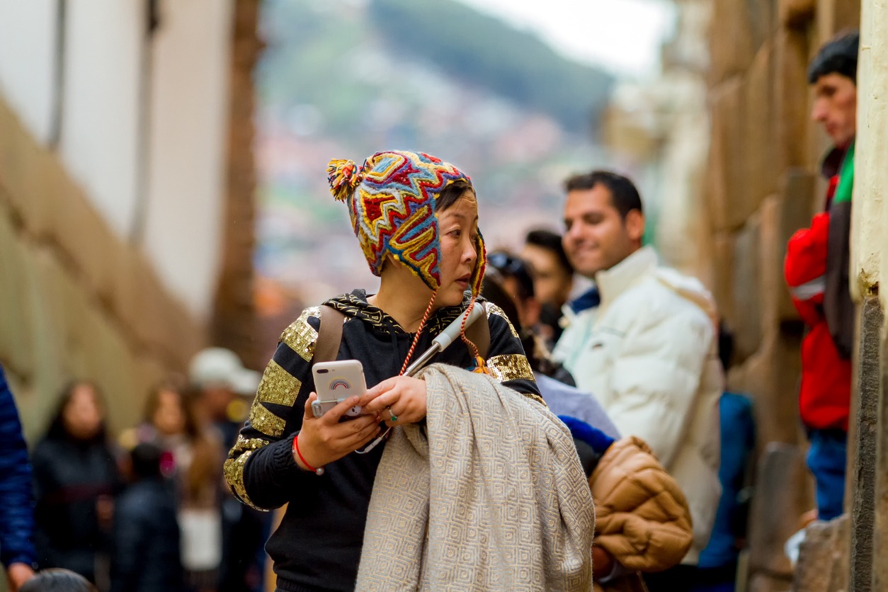a tourist wearing a Peruvian chullo hat