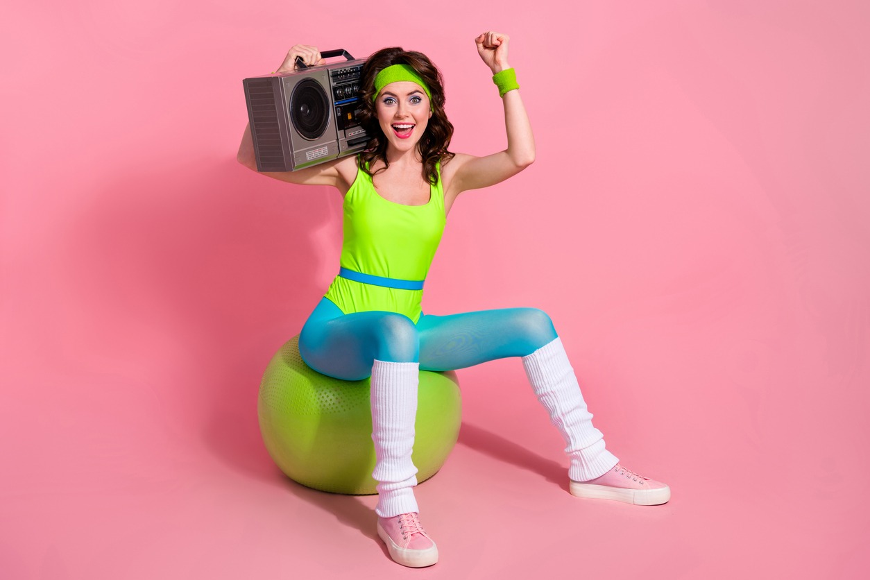 fitness trainer carrying a boombox