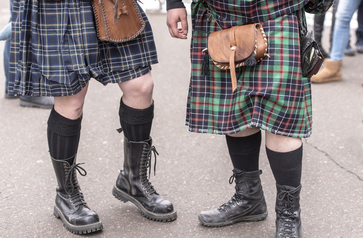two bagpipers dressed in traditional Scottish dress kilt
