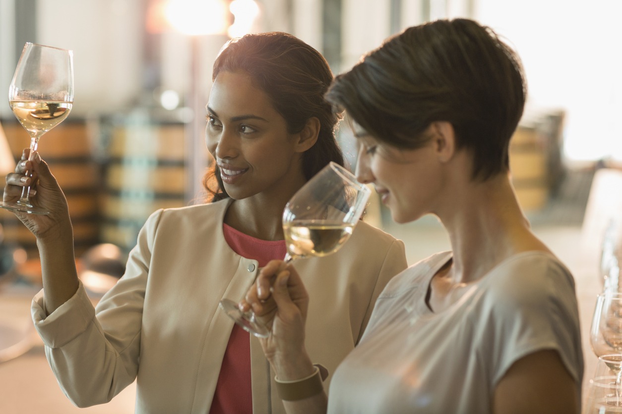 women wine tasting at winery