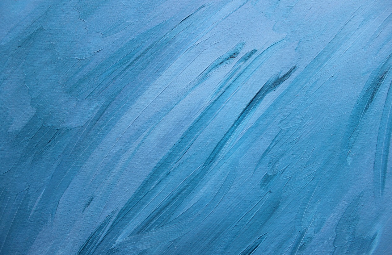Strokes of oil paint to canvas to create texture in different shades of blue
