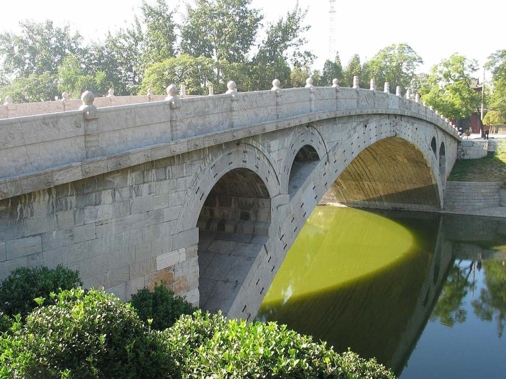 The Zhaozhou Bridge was built by the architect Li Chun from 595 to 605 AD, during the Chinese Sui Dynasty. It is the world's oldest fully-stone, open-spandrel, segmental arch bridge