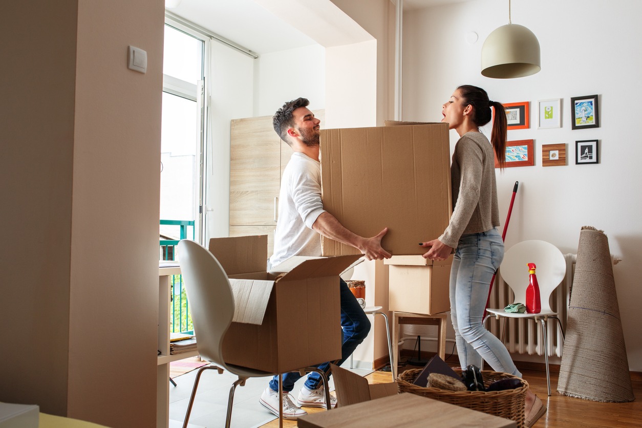 two people moving in an apartment