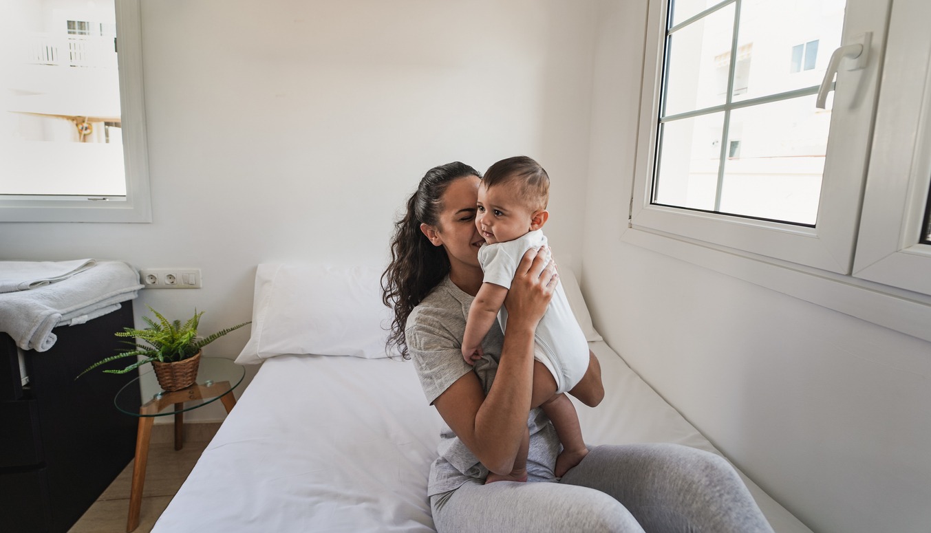 woman in a room with her baby