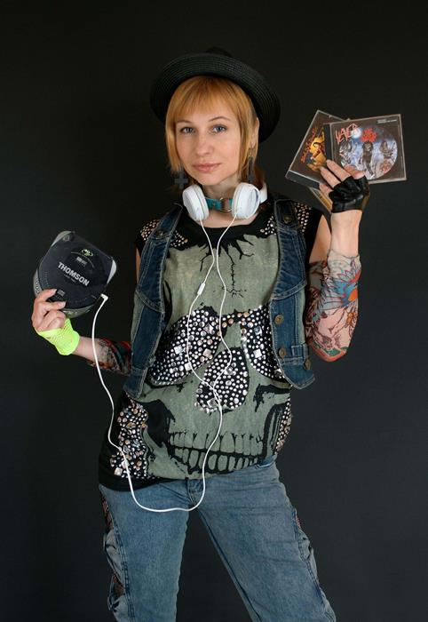 A woman holding CD Player