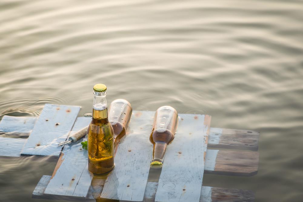 Beer bottles floating on the rustic wooden board