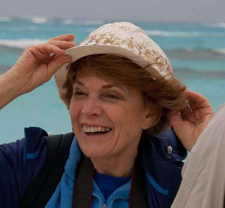 Dr. Sylvia Earle tries on a construction helmet found in plastic debris