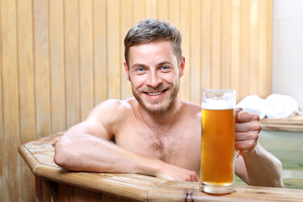Man enjoying beer in a spa