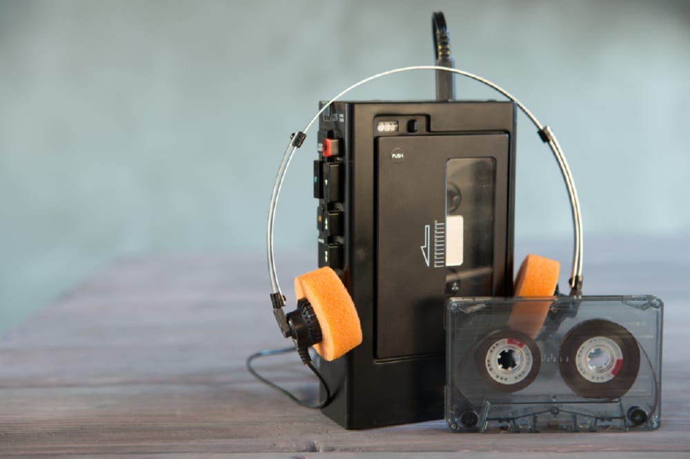 Old portable cassette player and headphones