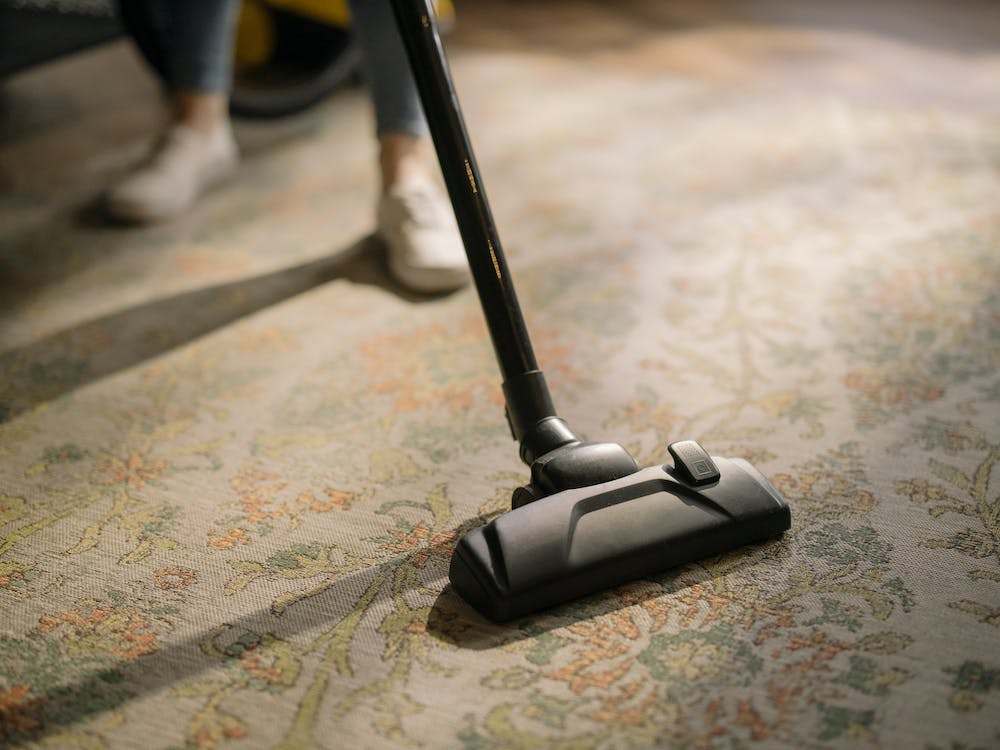 Vacuum cleaner on a rug